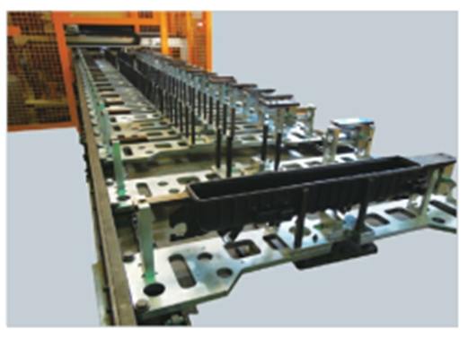 View of fixtures on conveyor.png